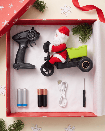 What's inside the Mini Santa box: RC tricycle, remote, rechargeable batteries, USB cable and screwdriver
